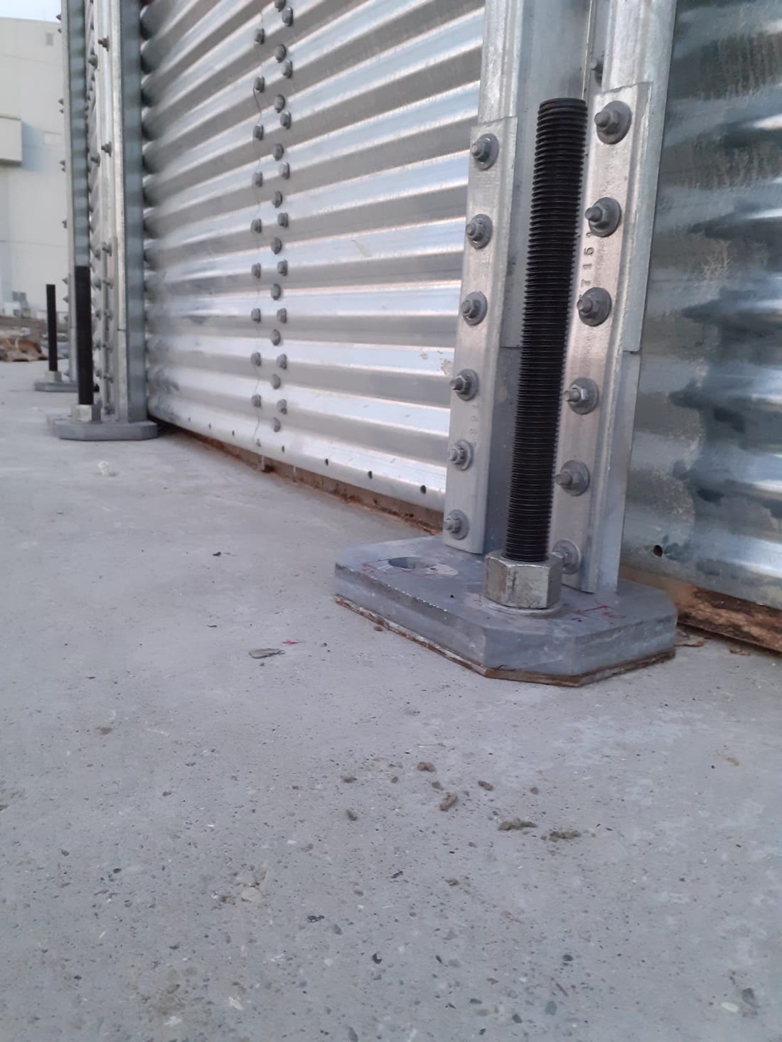 The base plate of a steel silo stiffener, fixed to the raft with an anchor bolt and nut